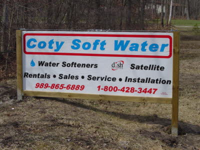 Simple Business Sign Mounted Between 2 Poles